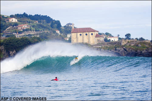 Mundaka certainly has to be one of the most amazing backdrops on the tour – a huge church sits behind the contest setup while steep brown cliffs and green hills silently guard the opening to the river mouth. Not to mention the barreling lefthander... Picture Credit ASP Tostee